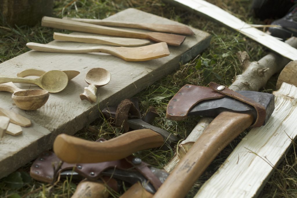 Four axes and a selection of spoons close-up